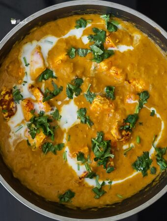 Paneer butter masala served in a pan