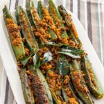 Stuffed Okra Recipe- stuffed bhindi served on a white plate.