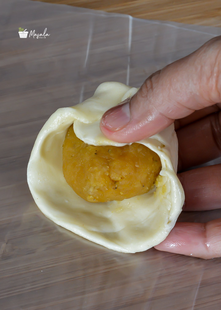 Stuffing puran in outer layer to make Bobbatlu or Puran Poli