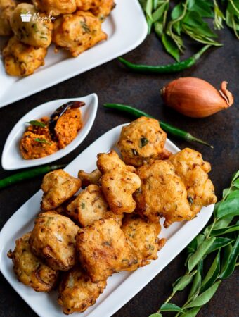 Punugulu served with chutney on a white plate