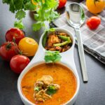 Chicken Rasam, Indian Chicken Soup served in a bowl.