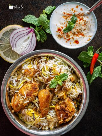 Chicken dum biryani hyderabadi style served with raita