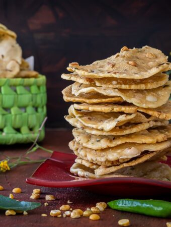 Chakkalu Savoury Rice Crackers stacked on a plate.