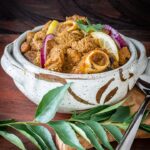 Andhra spicy mutton curry served in a bowl.