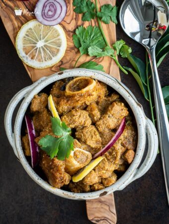 Andhra spicy mutton curry served in a bowl.