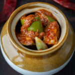 Mango pickle stored in a ceramic jar