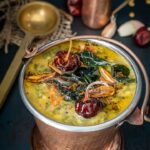 Palakura Pappu Andhra Style served in a copper bucket.