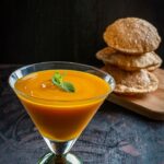 Aamras Puri served in a tall glass along with puris.