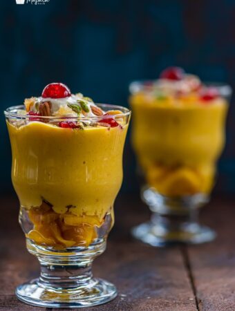 Mango Mastani Served in two tall glasses.