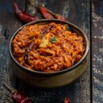 Instant grated mango pickle served in a bowl.