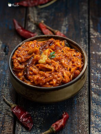 Instant grated mango pickle served in a bowl.