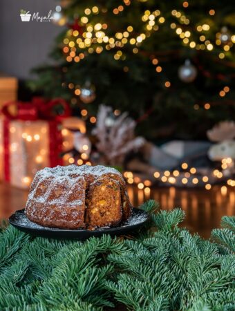 Christmas plum cake with Christmas tree decoration.