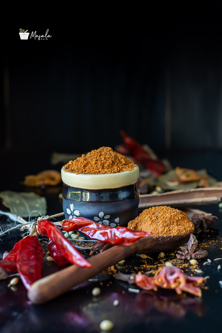 Homemade Pav bhaji masala powder with spices in frame.