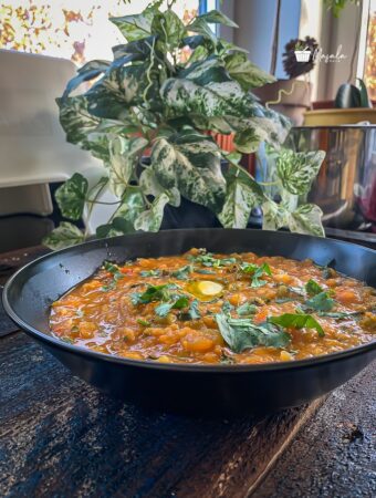 Pav bhaji in instant pot seved with a dollop of ghee.