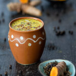 Golden Turmeric Milk Recipe aka Haldi Doodh with ingredients in the background