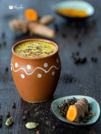 Golden Turmeric Milk Recipe aka Haldi Doodh with ingredients in the background