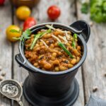 Black eyed peas curry served in a black bucket