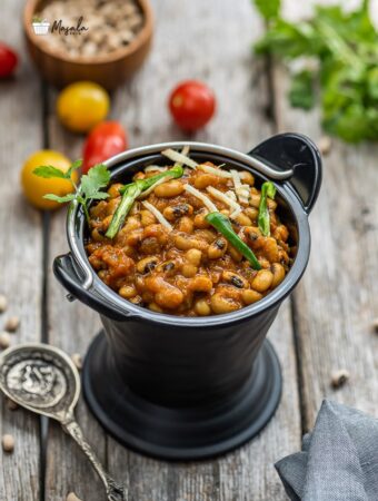 Black eyed peas curry served in a black bucket