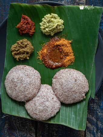 Ragi Idli served with an array of side dishes on a banana leaf