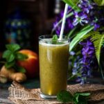 Apple Ginger Mint Juice served in a tall glass.