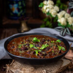 Punjabi Rajma Masala served in a black bowl.