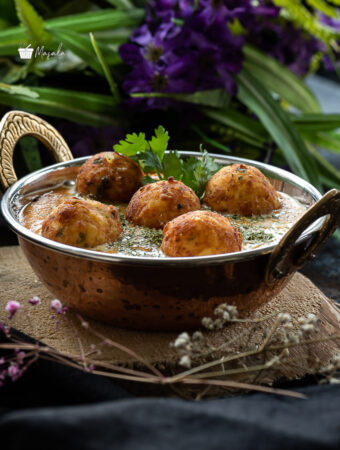 Malai Kofta Recipe Restaurant Style served in a copper kadai