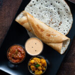 Methi Dosa Recipe served with an array of condiments.