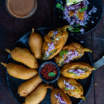 Mirchi bajji served with onions